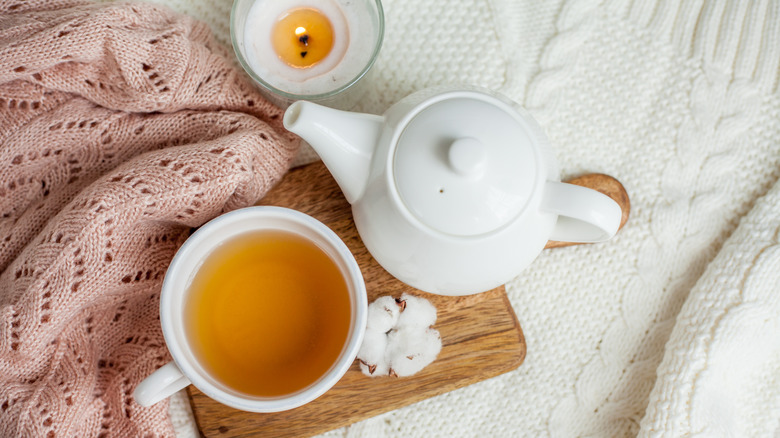 tea on blankets with candle 