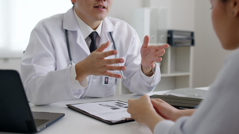 doctor consulting with patient at desk