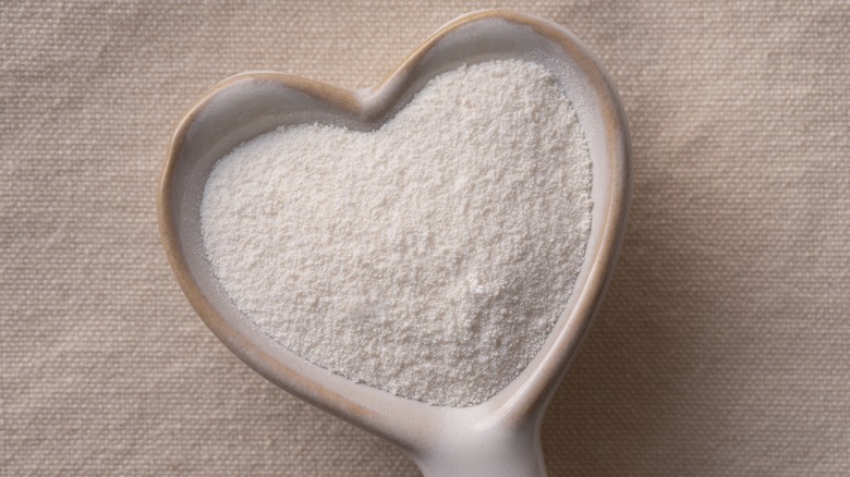 Powdered coffee creamer in a heart-shaped dish