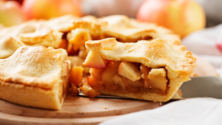 Sliced apple pie being served