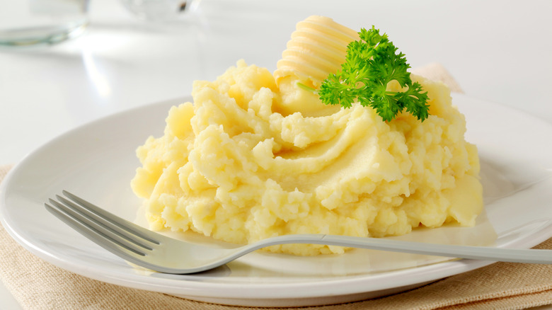 mashed potatoes on plate with fork 