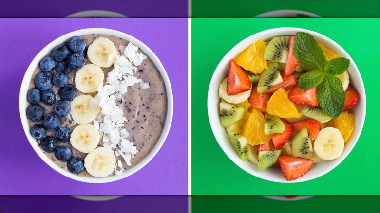 Blueberry smoothie bowl side by side with fresh fruit salad