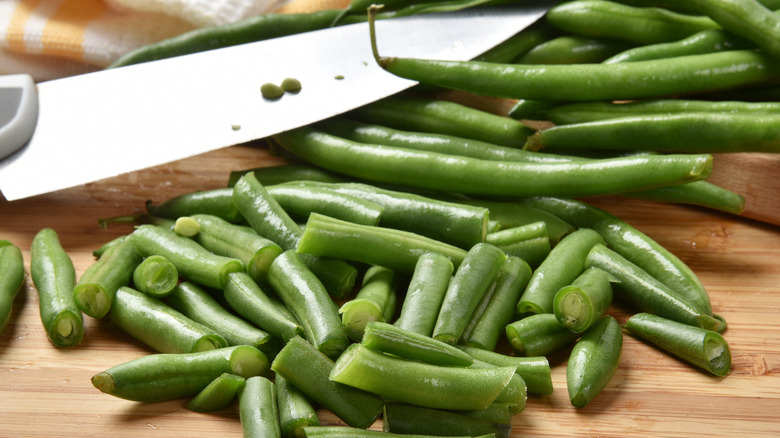 Fresh green beans with knife