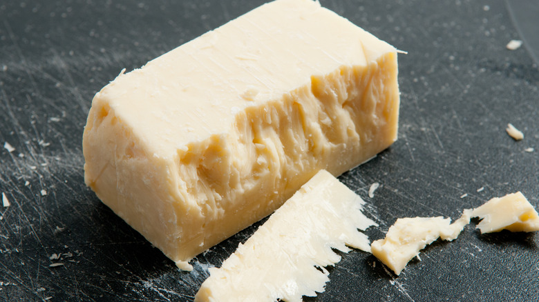 Block of sharp white cheddar cheese