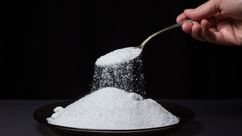 spoon pouring salt 