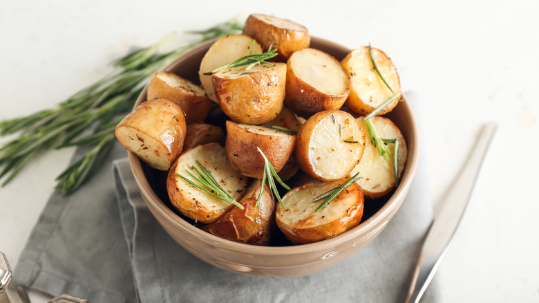 Roast potatoes in an air fryer basket 