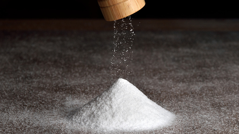 pile of salt under salt grinder