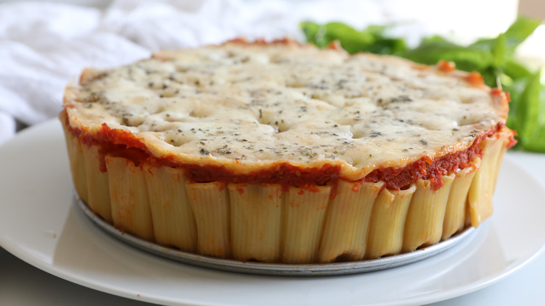 rigatoni pasta pie topped with cheese