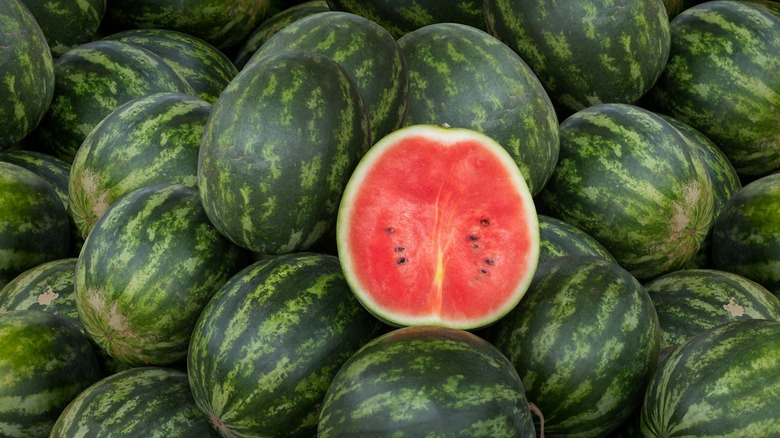 Halved watermelon and whole watermelons