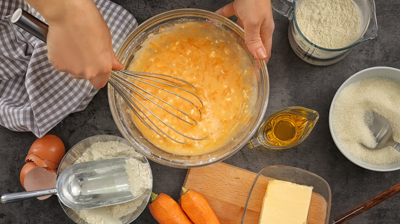 making carrot cake with ingredients on table