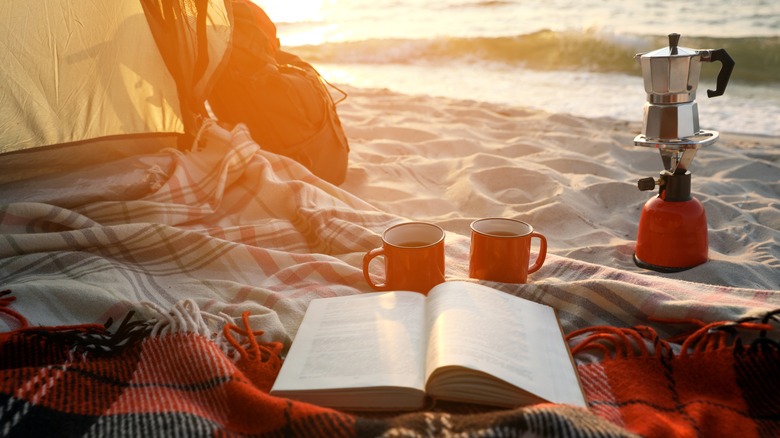 coffee mugs on the beach 