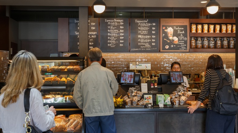 customers ordering at Starbucks store