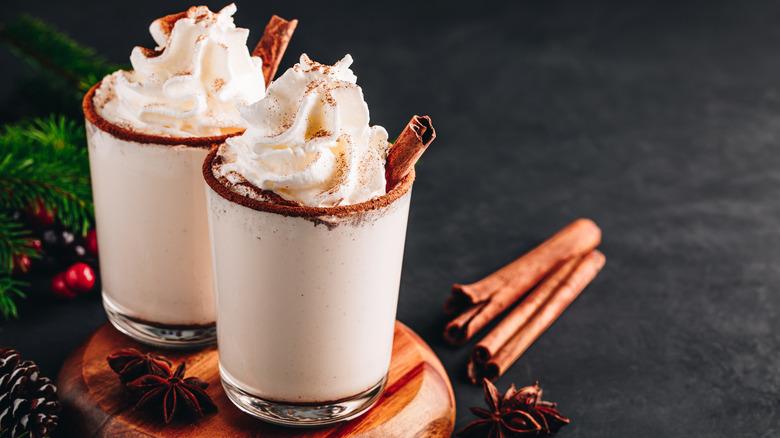 Eggnog with whipped cream and cinnamon 