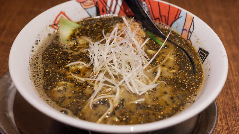 black tan tan noodles in soup