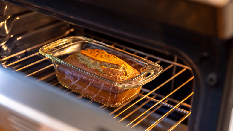 bread in a glass pan in oven