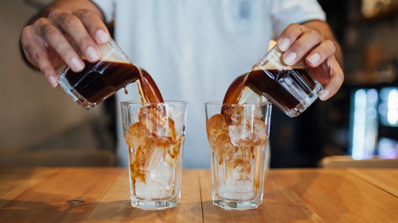 Man pouring espresso over ice