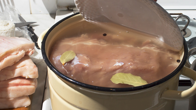 Soaking pork in brine