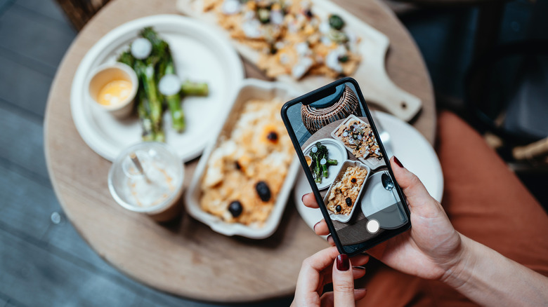 Influencer taking picture of food