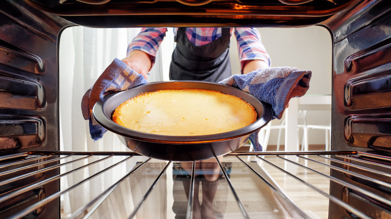 taking cake out of oven