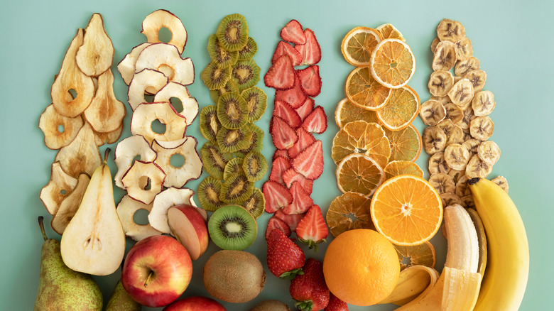 lines of dried fruit next to fresh fruit