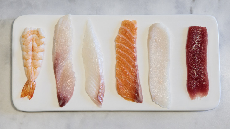 different raw fish pieces for sushi