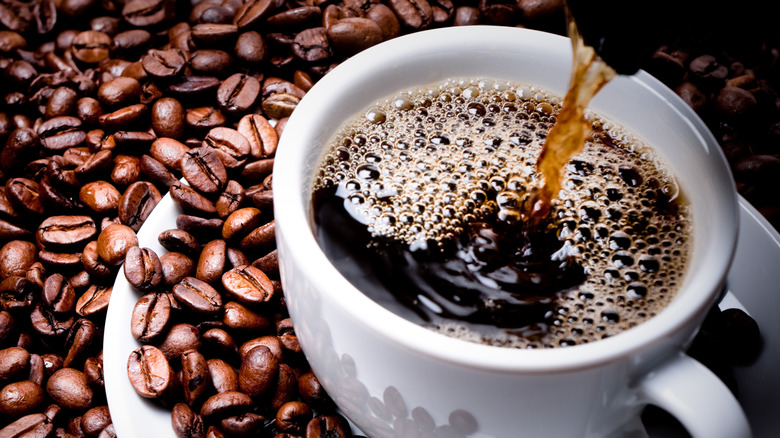 Pouring black coffee