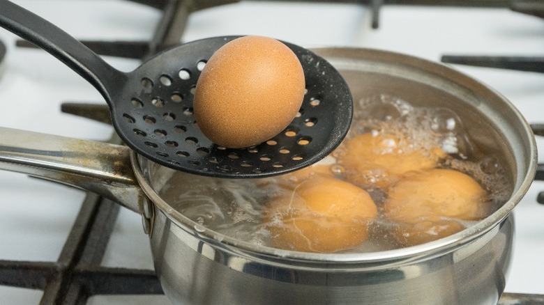 a pan of boiling eggs