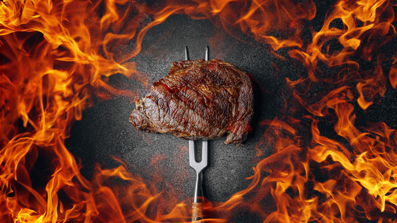 Steak with flame surrounding