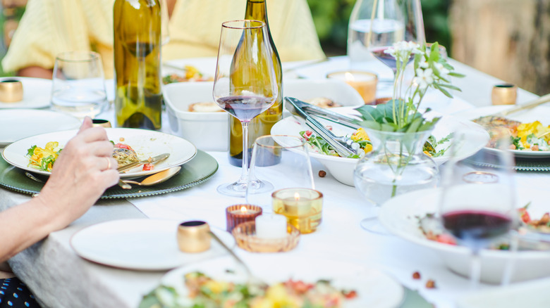 al fresco dining table with food and wine