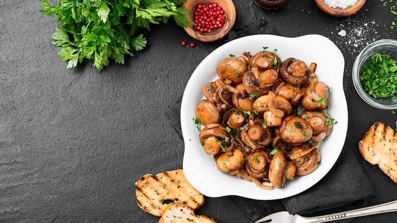 Mushrooms and onions on plate