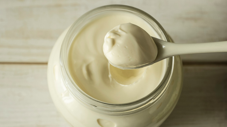 Jar of mayonnaise with spoon