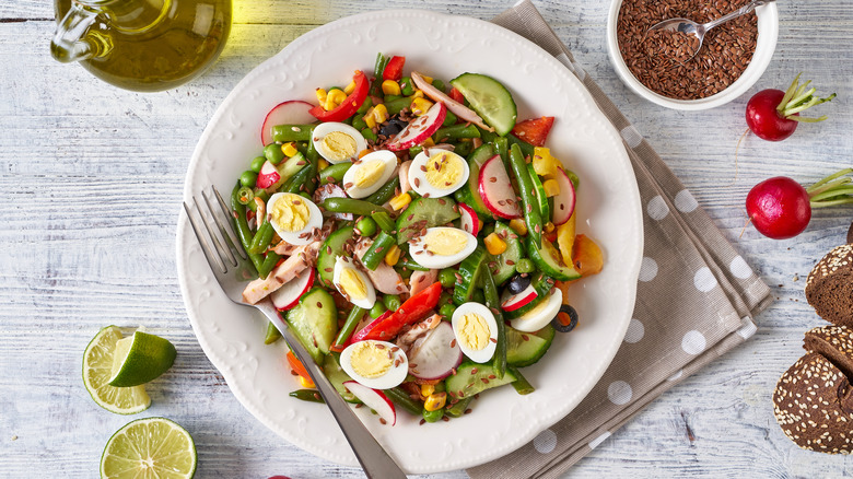 Veggie and egg salad with condiments