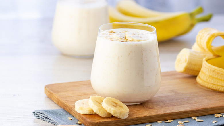 Smoothie in a glass with banana pieces