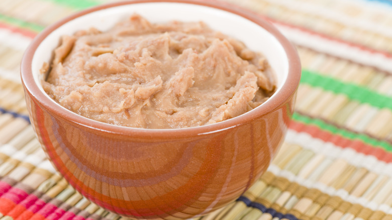 A dish of creamy refried beans