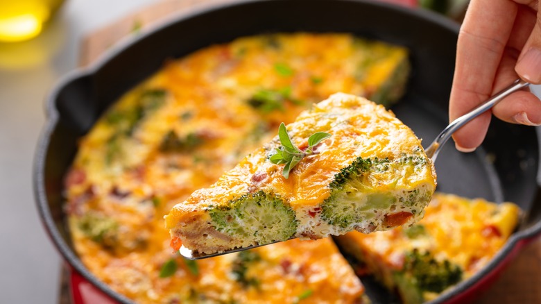 Cast iron frittata with serving spoon