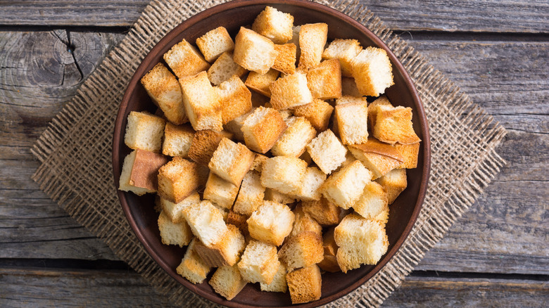homemade croutons in brown bowl