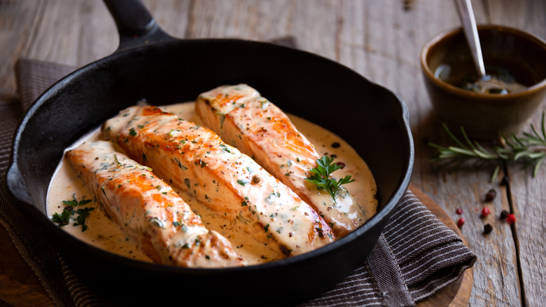 Salmon frying in white sauce