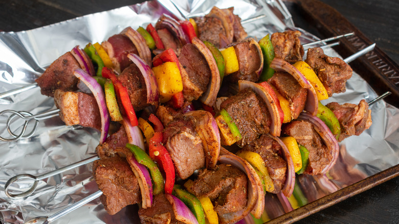 Foil-lined baking sheet with seafood