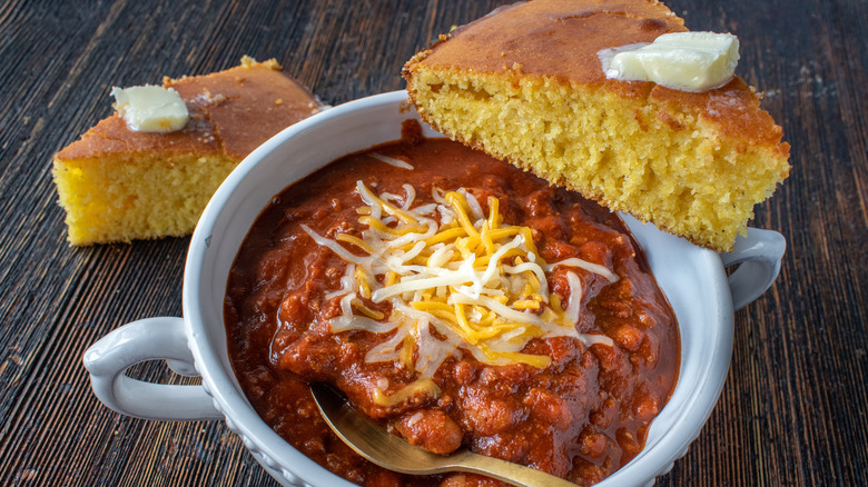 bowl of chili with cornbread squares