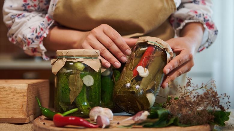 woman canning pickles