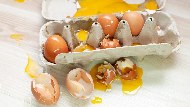 carton of broken eggs