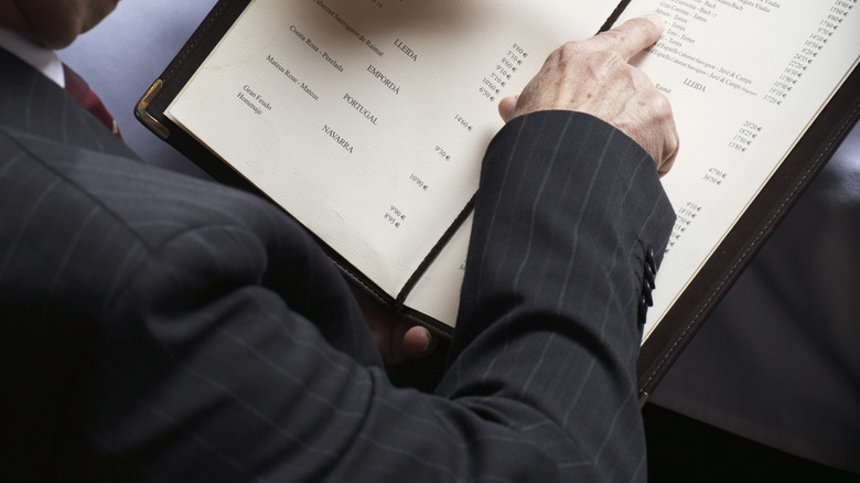 Person reading a menu