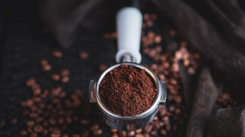 Scoop of ground coffee.