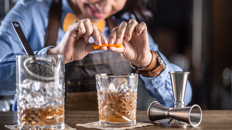 Bartender makes an Old Fashioned