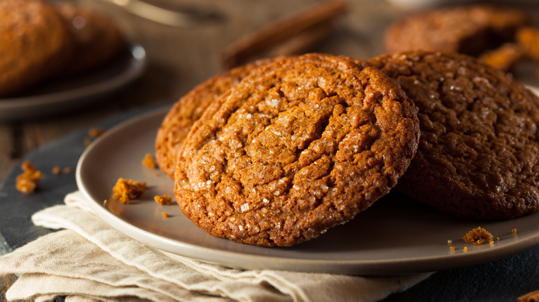 two gingersnap cookies on a plate