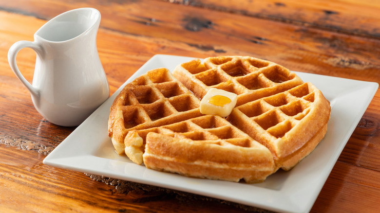 waffles on plate with white jug