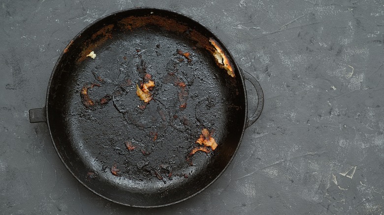 damaged cast iron pan with orange spots