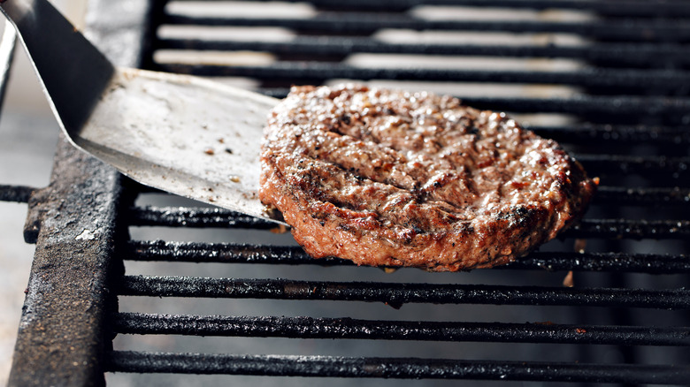 Spatula flipping burger