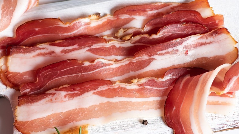 Close-up of bacon strips out of packaging