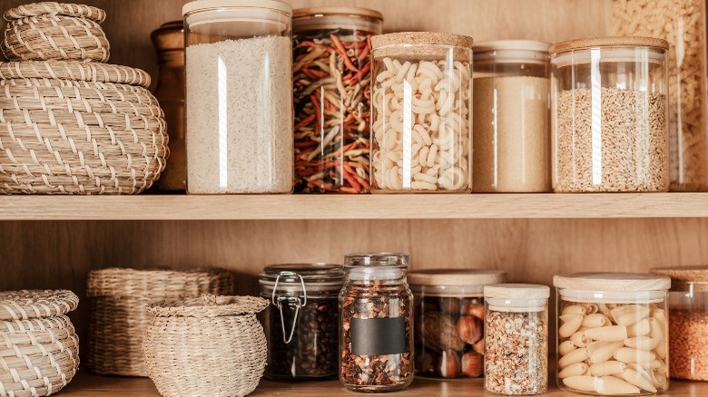 Dried pasta in containers on a shelf